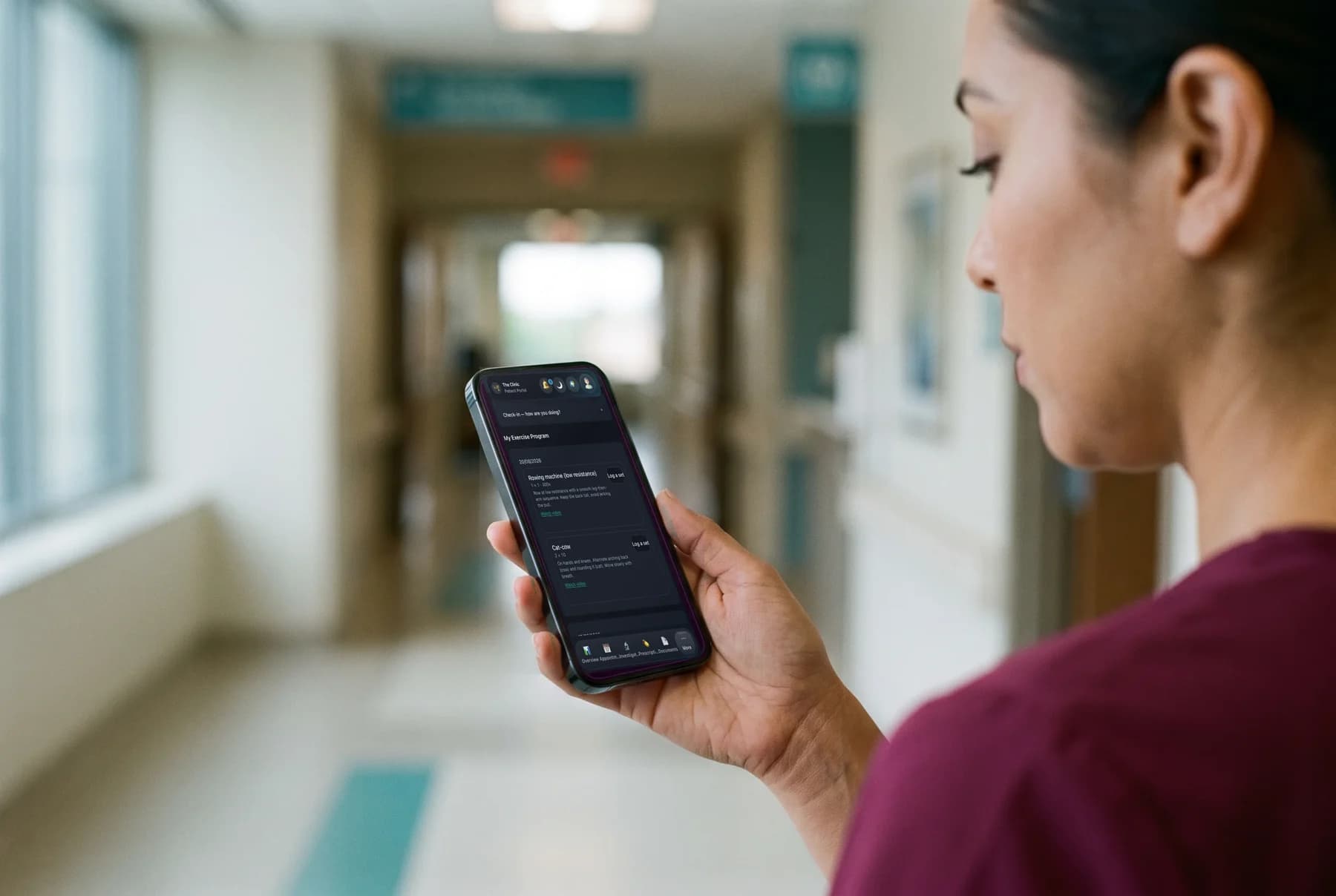 A nurse reading a patient message on a phone